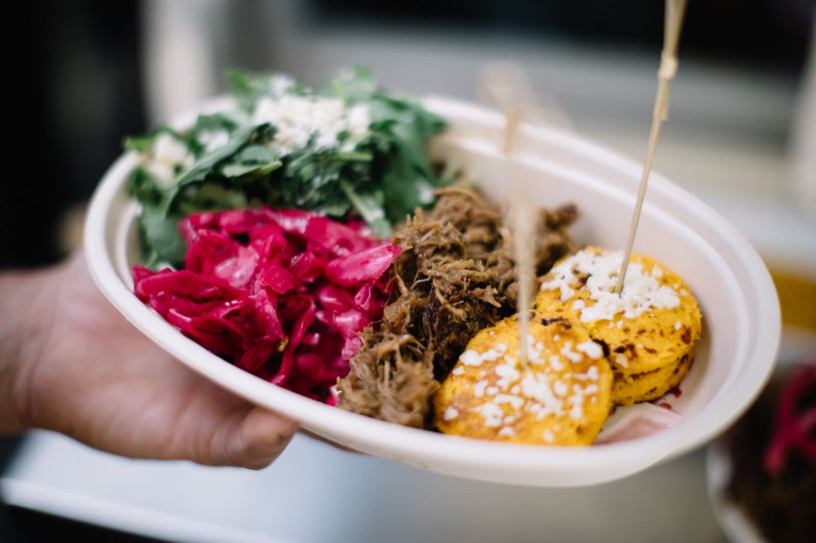 Cachapa Stack: two sweet-corn cachapas layered with pulled lamb and crumbled cotija.